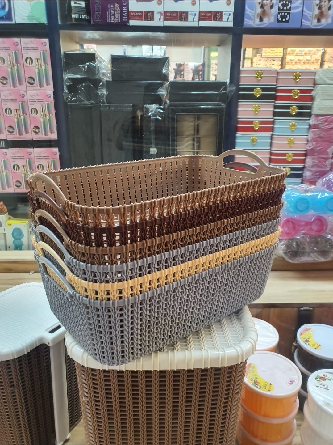 stack of multipurpose plastic storage baskets, designed with a wicker-like pattern.